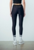 LEGGINGS IN LYCRA CON DETTAGLIO CINTO A BUSTINO E FLAG