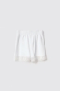 Short in felpa con balza in pizzo macramè • Bianco