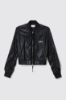 Bomber nylon cropped zippato con smacchinato su polsi e stampa • Nero