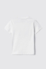 T-shirt paricollo con logo in strass+borchie • Bianco