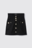 Gonna con corpetto in denim • Nero