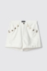 Short loose fit con bottoni gioiello su tasche • Off white