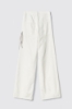 Pantalone boy over loose fit con catene strass • Off white