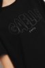 T shirt jersey paricollo con apertura sul retro e a contrasto • Nero