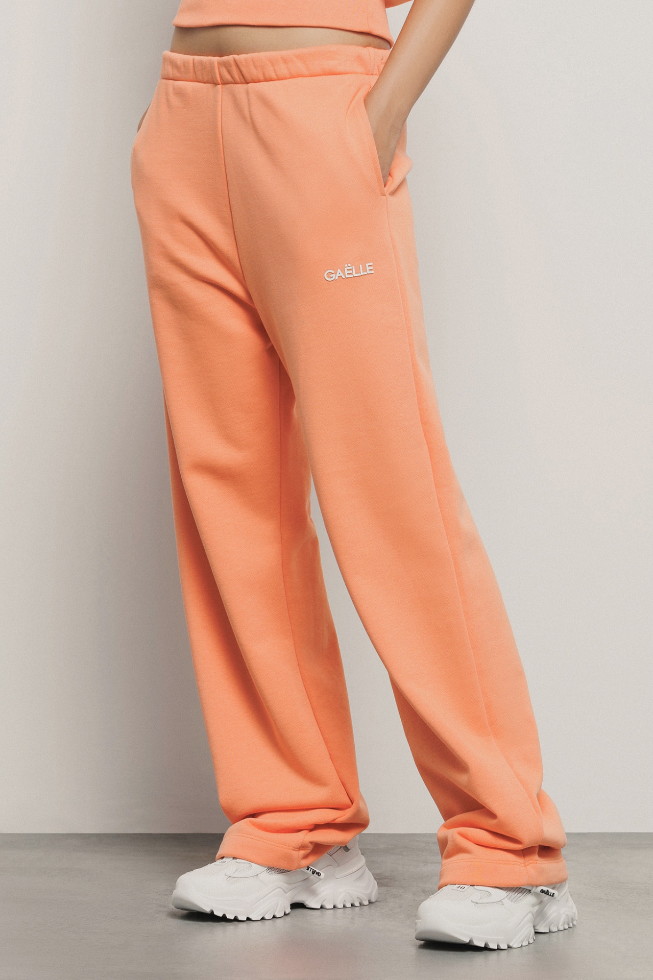 Pantalone palazzo in felpa con tasche alla francese e stampa • Arancione melone