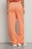 Pantalone palazzo in felpa con tasche alla francese e stampa • Arancione melone