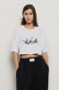 T shirt jersey paricollo con stampa • Bianco