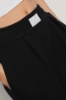 Pantalone dritto con etichetta davanti • Nero