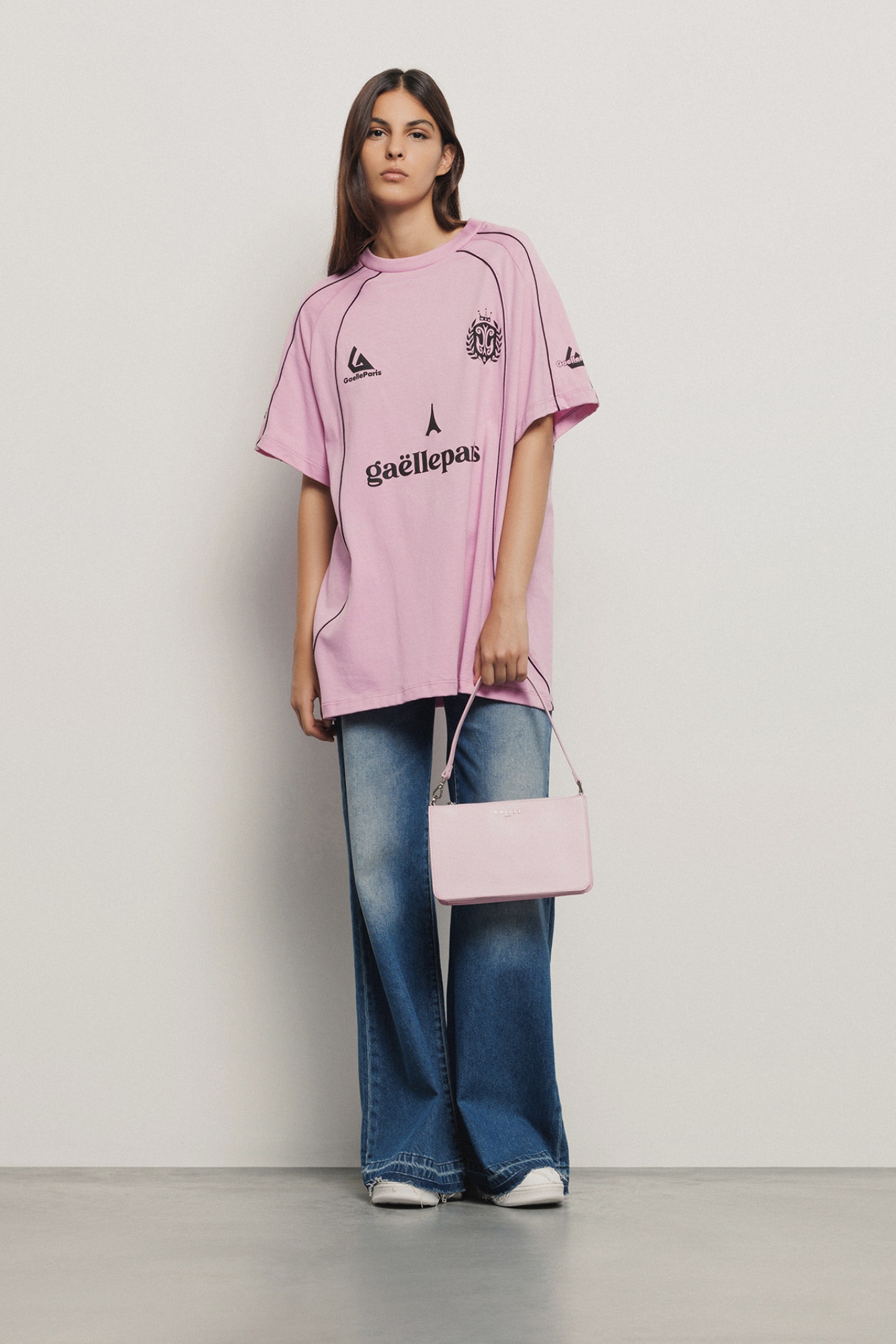 Mini pochette con logo in metallo • Rosa