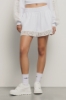 Short in felpa con balza in pizzo macramè • Bianco
