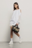 Short in felpa con balza in pizzo macramè • Bianco