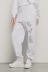 Pantalone in felpa tasche alla francese e ricamo • Bianco