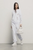 Pantalone in felpa tasche alla francese e ricamo • Bianco