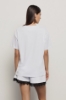 T shirt in jersey over paricollo con stampa • Bianco