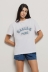 T shirt in jersey paricollo con ricamo • Bianco