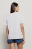 T shirt in jersey paricollo con ricamo • Bianco