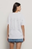 T shirt in jersey paricollo con strass • Bianco