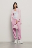 Pantalone in felpa tasche alla francese e stampa • Rosa orchidea