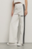 Pantalone palazzo con bande su fianchi e stampa • Bianco