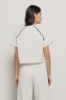 T shirt crop paricollo raglan con inserti profilo • Bianco