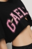 T shirt crop in jersey paricollo dettaglio taglio con stampa • Nero