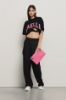 T shirt crop in jersey paricollo dettaglio taglio con stampa • Nero
