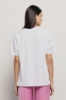 T shirt jersey paricollo con maxi stampa • Bianco