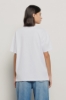 T shirt in jersey paricollo con stampa • Bianco