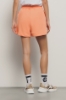 Short in felpa con cinto elastico e stampa • Arancio