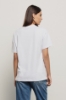 T shirt in jersey paricollo con ricamo • Bianco