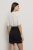 Abito corto all-in-one in cady e modal • Nero bianco