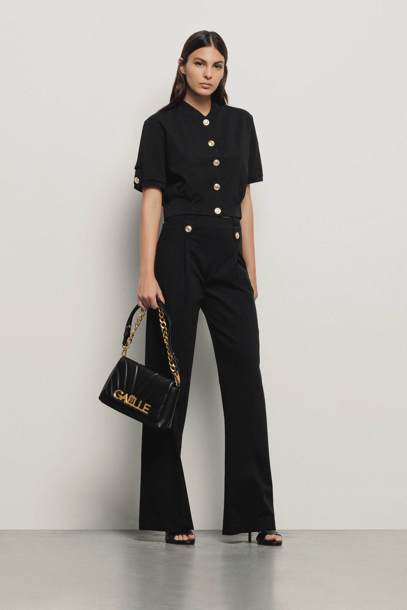 Reg shoulder strap con matelasse' e logo con chiusura a girello • Nero