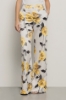 Pantalone a palazzo in raso stampato • Rose gialle