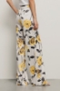 Pantalone a palazzo in raso stampato • Rose gialle