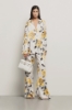 Pantalone a palazzo in raso stampato • Rose gialle