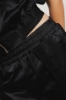 Giubbino smanicato con elastico logato sul fondo • Nero