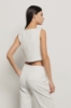 Top crop smanicato con bottoni in cady • Gesso