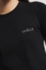 T-shirt paricollo in bielastico con logo in strass • Nero