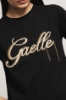 T-shirt paricollo con ricamo • Nero