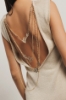 Top con dettaglio sul retro in maglia lurex • Oro