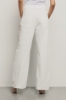 Pantalone boy over loose fit con catene strass • Off white