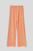 Immagine di Pantalone palazzo in felpa con tasche alla francese e stampa • Arancione melone