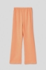 Immagine di Pantalone palazzo in felpa con tasche alla francese e stampa • Arancione melone