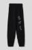 Picture of Fleece trousers with French pockets and embroidery • Black