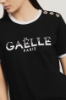 T-shirt paricollo con stampa logo e bottoni logati oro • Nero