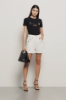 T-shirt paricollo con appl. brick oro/argento • Nero