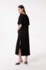 Abito Lungo In Jersey Paricollo Mezza Manica Con Spacco Laterale • Nero