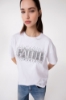 T-Shirt Paricollo Mezza Manica Con Ricamo E Appl. Strass • Bianco